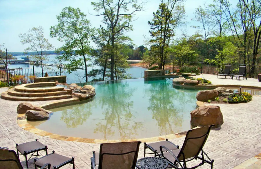Lap pool surrounded by lush landscaping